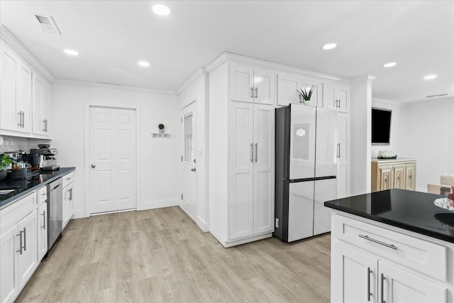 kitchen with dishwasher, white cabinets, and refrigerator