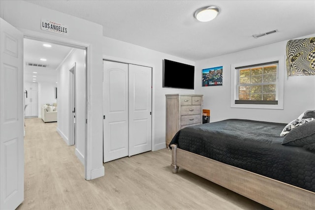 bedroom with a closet and light wood-type flooring