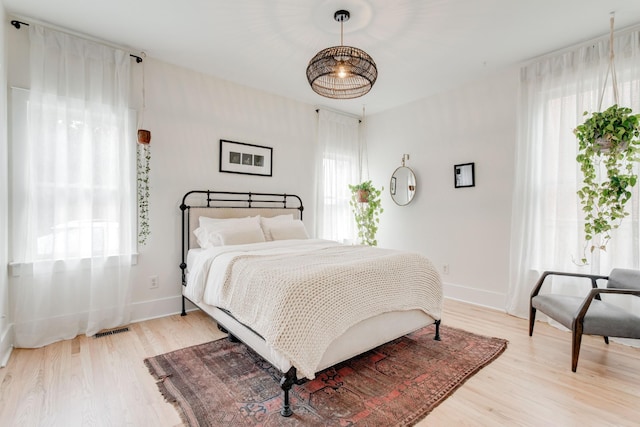 bedroom with light hardwood / wood-style floors