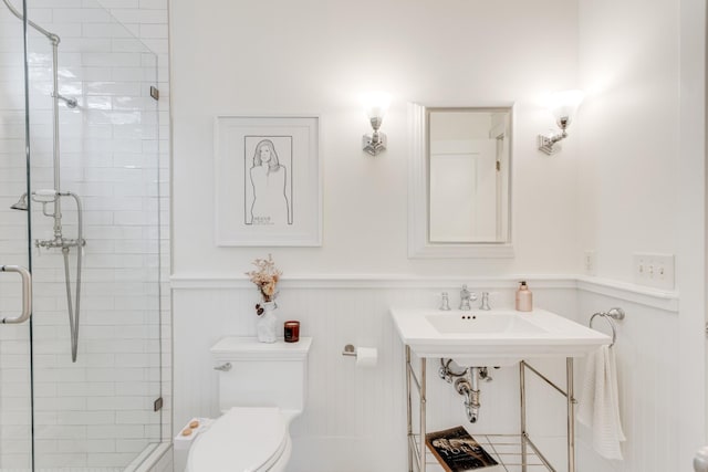 bathroom featuring an enclosed shower and toilet