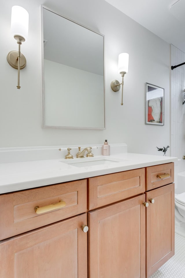 bathroom with vanity and toilet