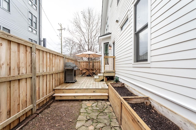 wooden deck with grilling area