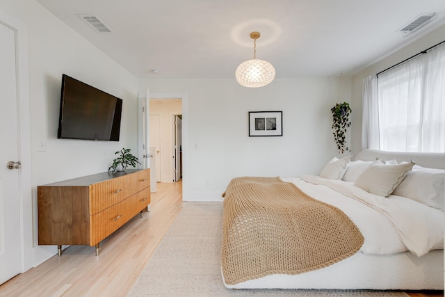 bedroom with light hardwood / wood-style floors