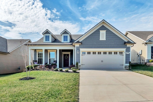 view of front facade featuring a garage, a front lawn, and covered porch