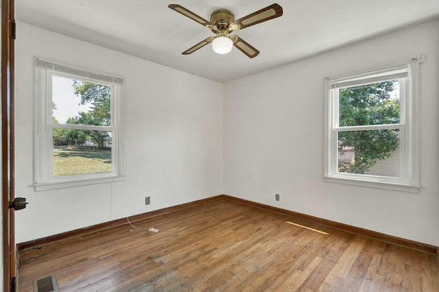 empty room featuring ceiling fan and wood-type flooring