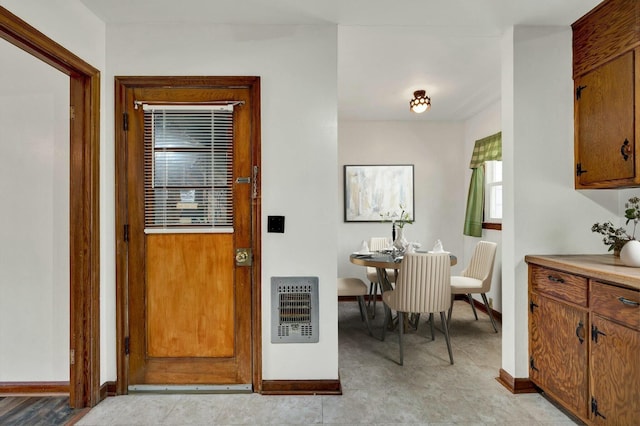 dining room featuring heating unit