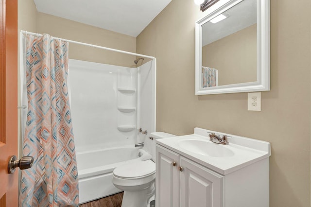 full bathroom featuring shower / tub combo, vanity, and toilet