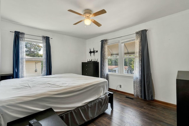 bedroom featuring dark wood-type flooring and ceiling fan