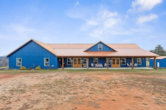 rear view of property with a patio area