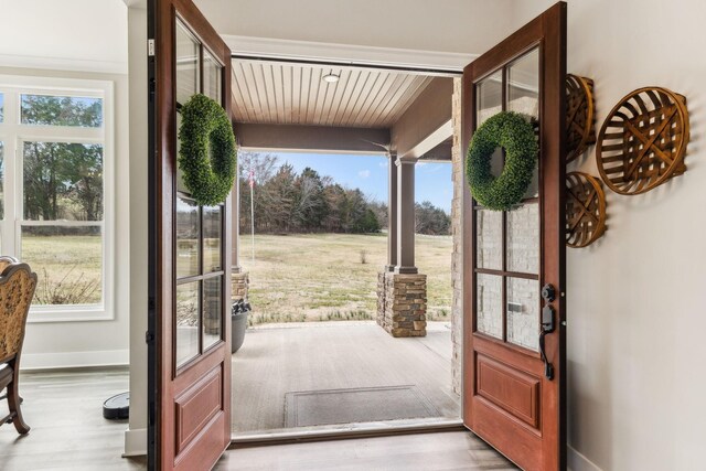 doorway with light hardwood / wood-style flooring