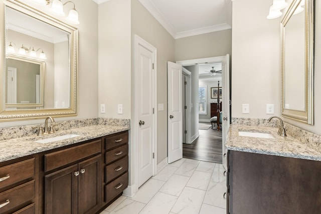 bathroom with ceiling fan, crown molding, and vanity