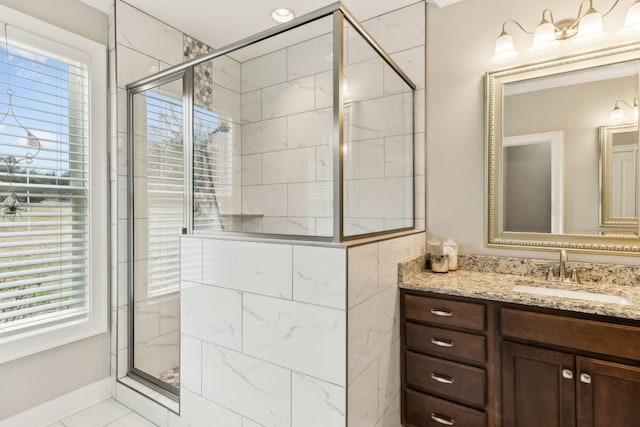 bathroom featuring vanity and walk in shower