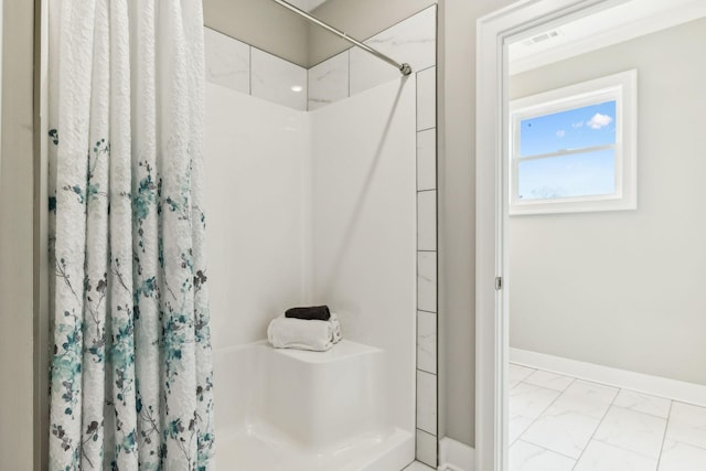 bathroom with curtained shower