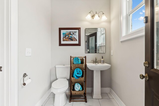 bathroom featuring tile patterned floors and toilet