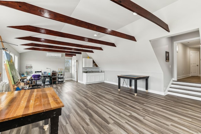 living room featuring wood-type flooring, a wall mounted AC, and lofted ceiling with beams