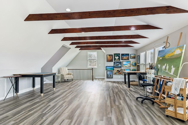 office featuring wood-type flooring and vaulted ceiling with beams