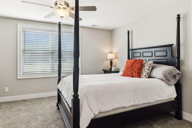 bedroom featuring multiple windows, carpet flooring, and ceiling fan