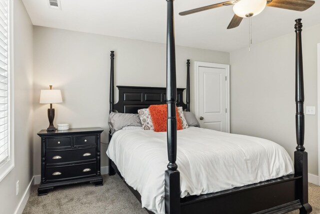 bedroom with light carpet and ceiling fan