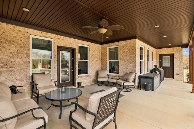 view of patio with ceiling fan, a grill, and an outdoor hangout area