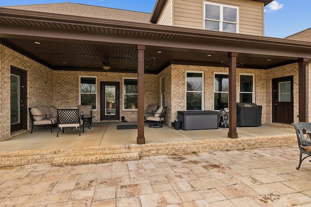 view of patio / terrace with ceiling fan and grilling area