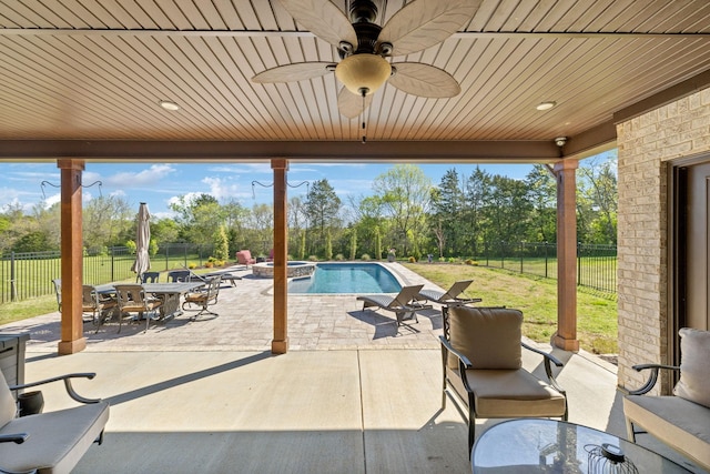 8760 Rocky Fork Rd, Smyrna, TN 37167 - view of patio / terrace featuring outdoor dining area, a pool with connected hot tub, a ceiling fan, and a fenced backyard