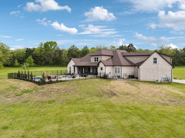8760 Rocky Fork Rd, Smyrna, TN 37167 - back of property featuring a lawn, a shingled roof, fence, and a patio
