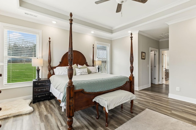 8760 Rocky Fork Rd, Smyrna, TN 37167 - bedroom with baseboards, visible vents, wood finished floors, and a tray ceiling
