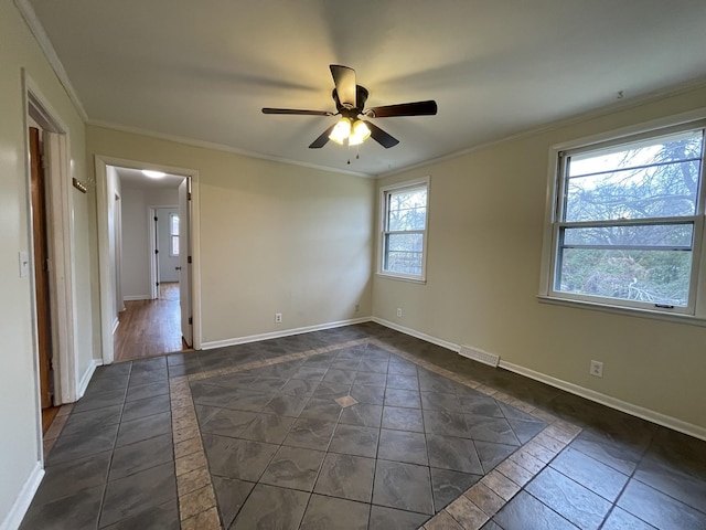 spare room with crown molding and ceiling fan