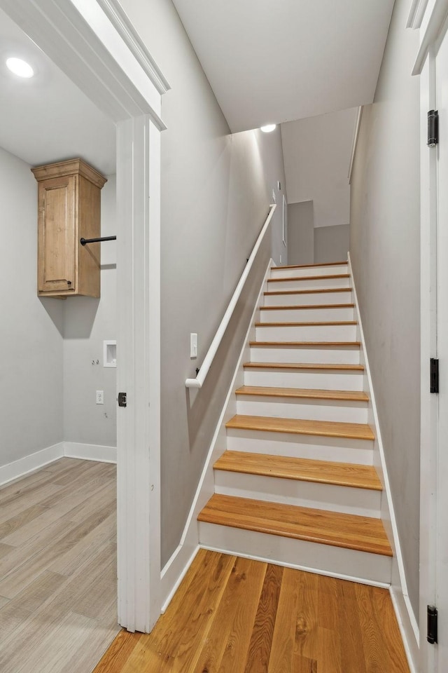 stairs with hardwood / wood-style floors