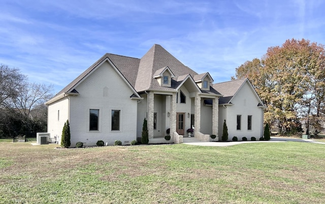 view of front of house featuring a front yard and central air condition unit