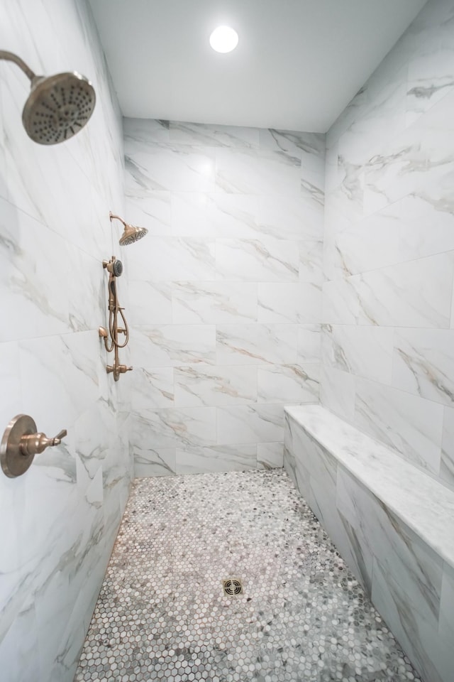 bathroom with tiled shower