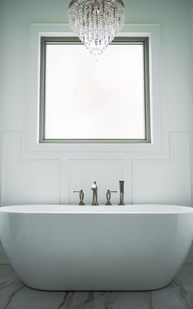 bathroom featuring a tub to relax in