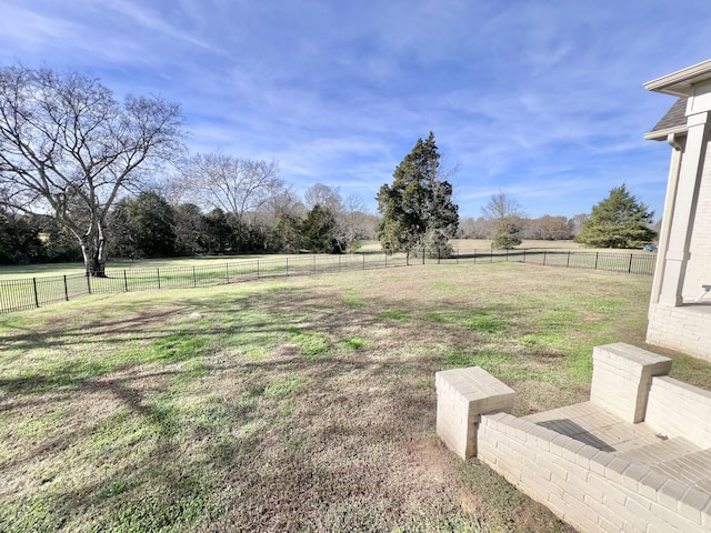 view of yard with a rural view