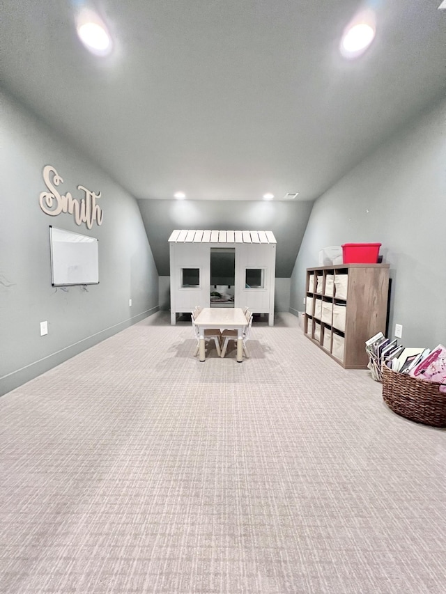 sitting room featuring light colored carpet