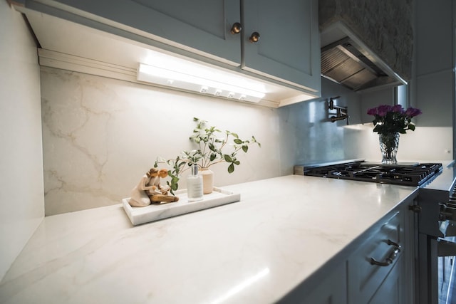 kitchen with wall chimney exhaust hood