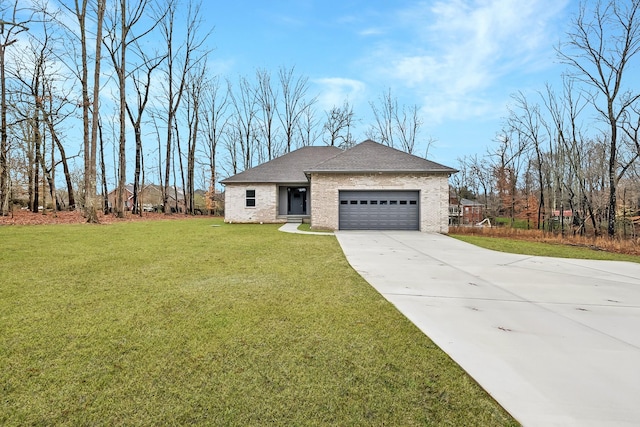 view of front of property with a garage and a front yard