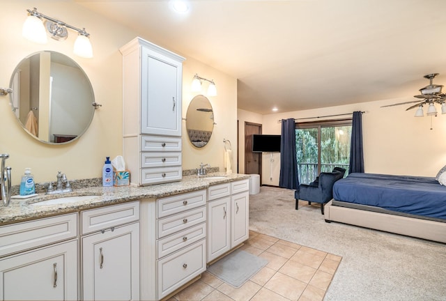 bathroom with ceiling fan, vanity, and tile patterned floors