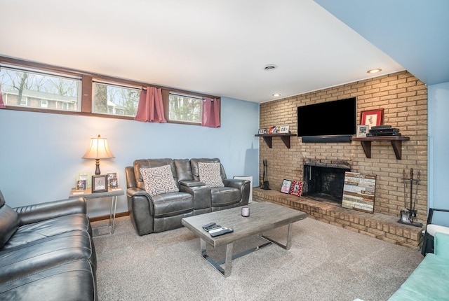 carpeted living room with a fireplace