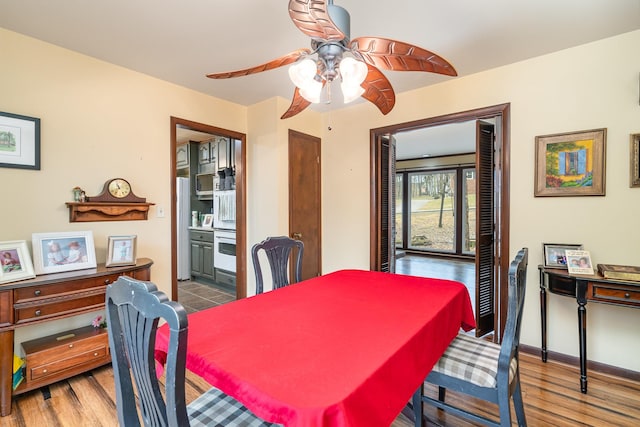 dining room featuring hardwood / wood-style flooring and ceiling fan