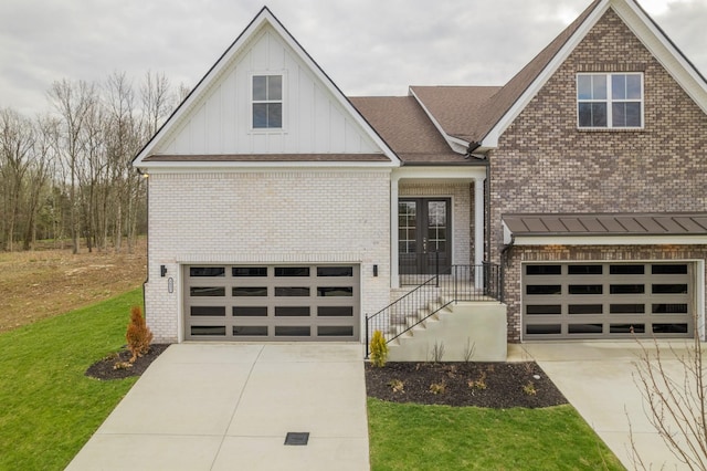 view of front of house with brick siding, an attached garage, concrete driveway, and a front lawn