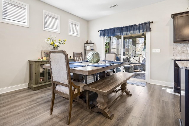 dining area featuring dark hardwood / wood-style flooring