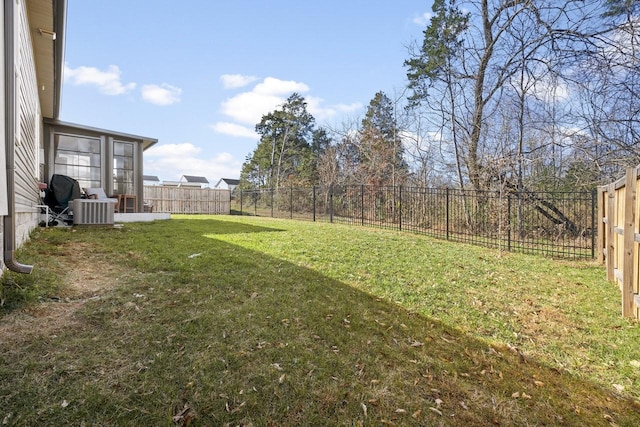 view of yard featuring central AC unit