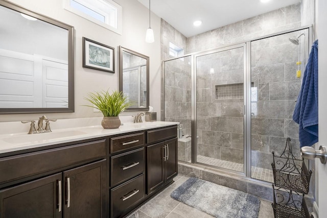 bathroom featuring tile patterned floors, vanity, and an enclosed shower