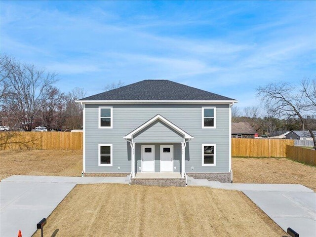 view of property with a front lawn and a porch