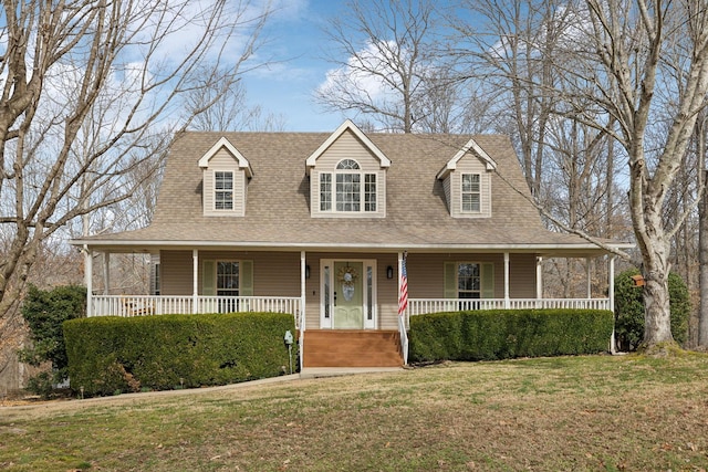 view of front of home featuring covered porch and a front yard