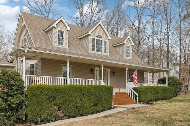 view of front of property featuring a porch and a front lawn