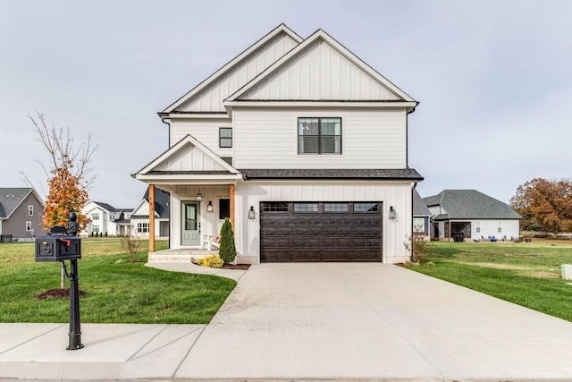 view of front of home featuring a garage and a front yard