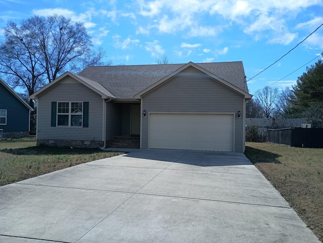 view of front of house featuring a garage and a front yard