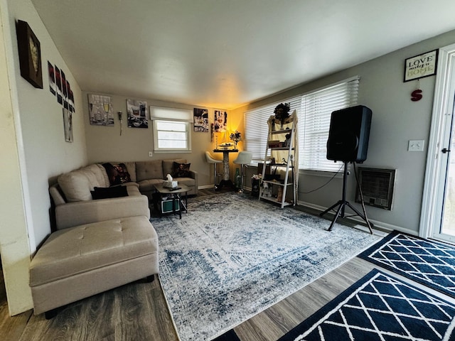 living room with hardwood / wood-style floors and heating unit