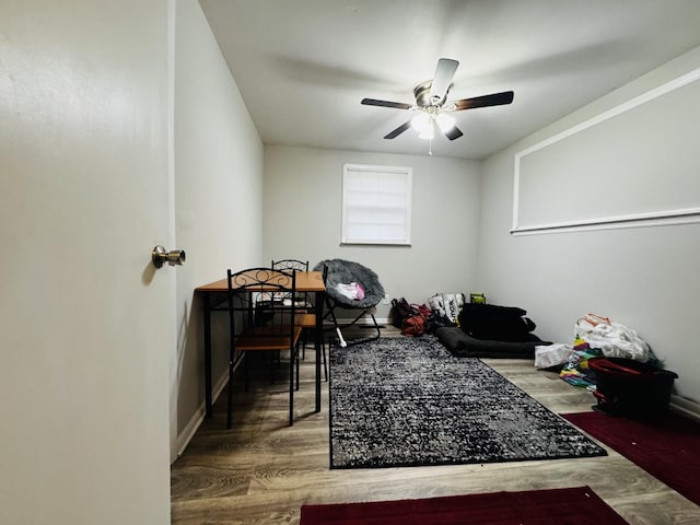 office space with wood-type flooring and ceiling fan